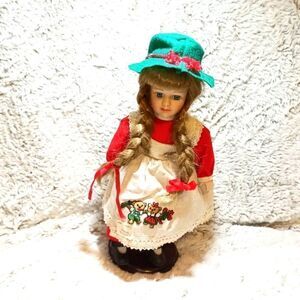 Schneider doll. Complete w green hat and doll stand.